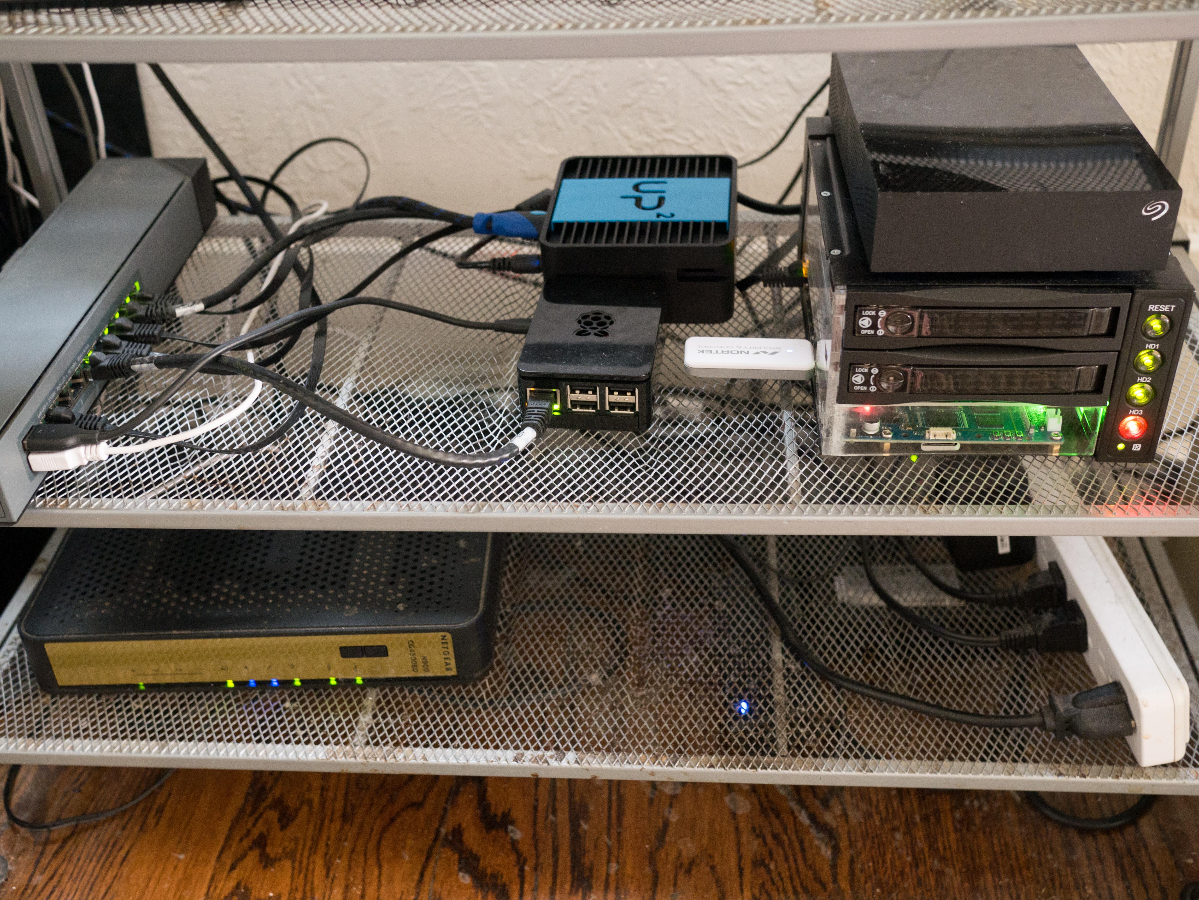 NAS and other home networking equipment on a wire shelf